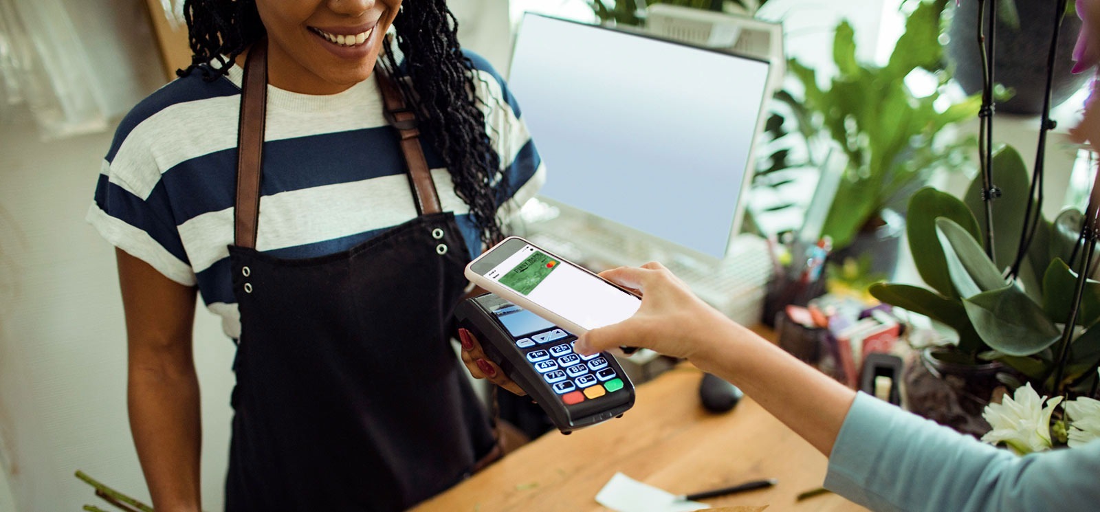 Woman paying with mobile wallet on phone.